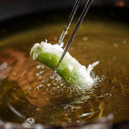 Hotel The Celestine Kyoto Gion Exteriör bild A spring roll being dipped in hot oil