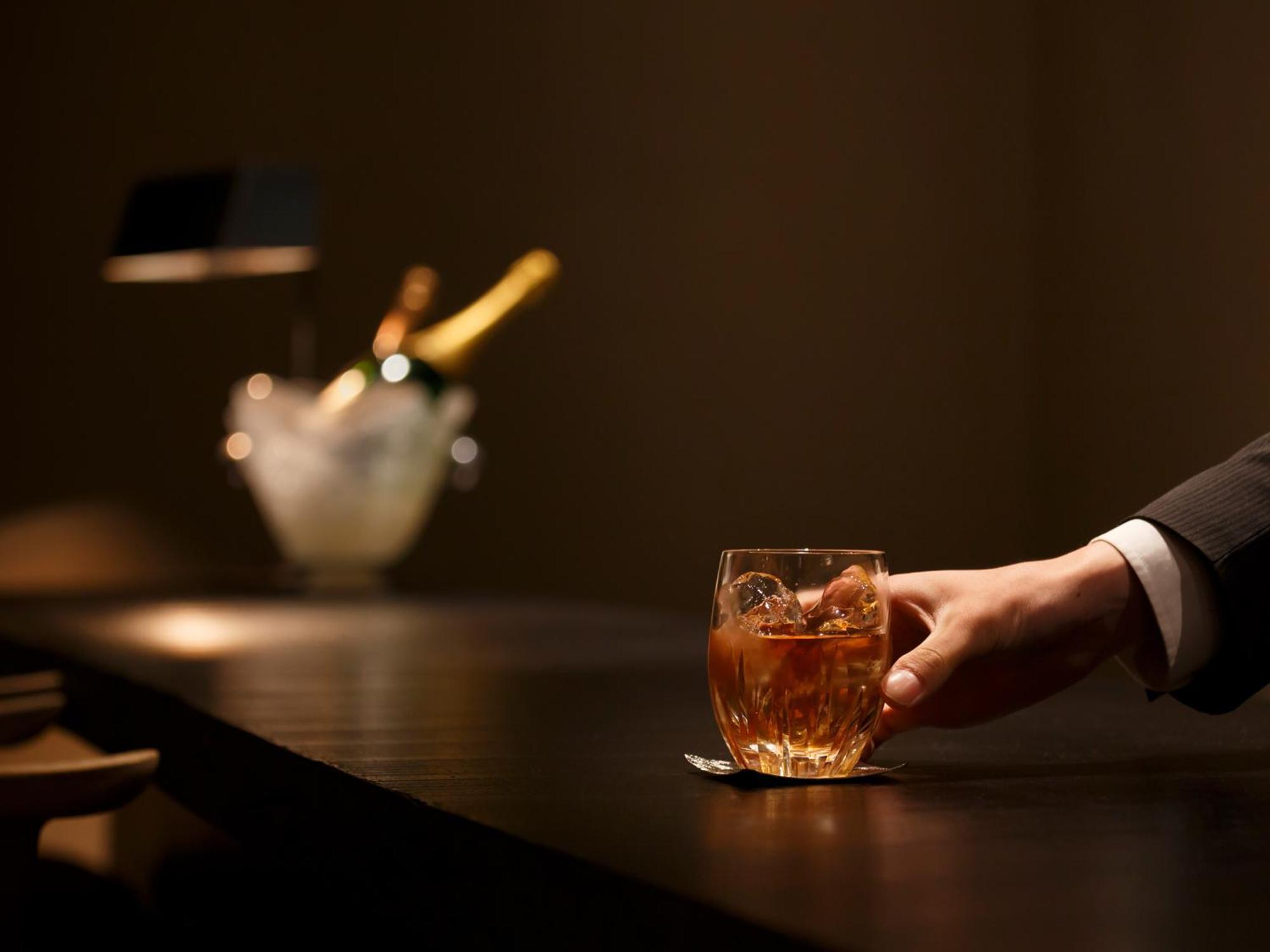 Hotel The Celestine Kyoto Gion Exteriör bild A bartender serving a drink